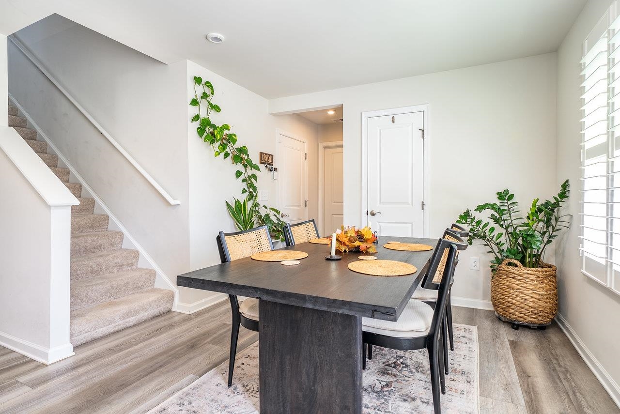1207 Watson Lane Grottoes, VA 24441 - Photo 69 of 75 a dining room with furniture potted plants and wooden floor