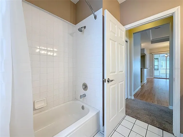 a bathroom with a bathtub and shower