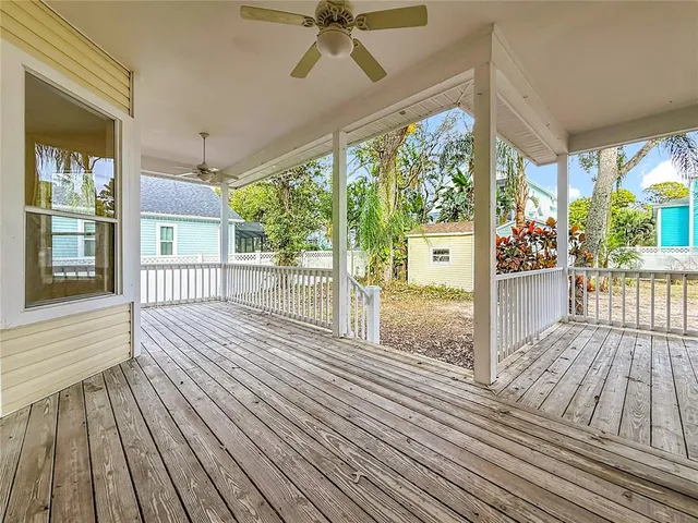 a view of a balcony with wooden floor