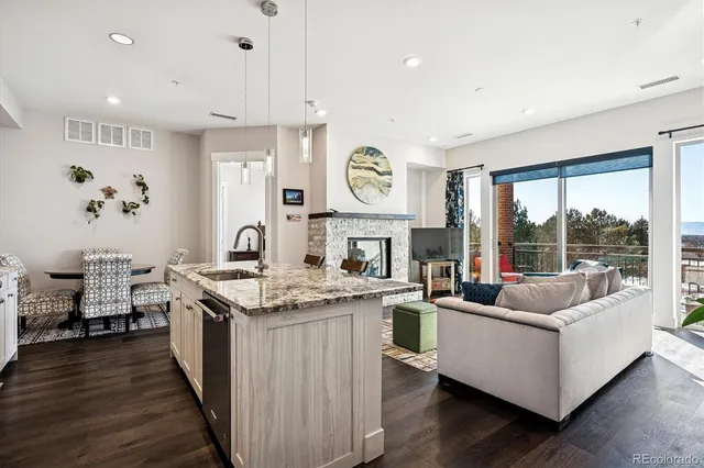 a open kitchen with stainless steel appliances granite countertop a stove and cabinets