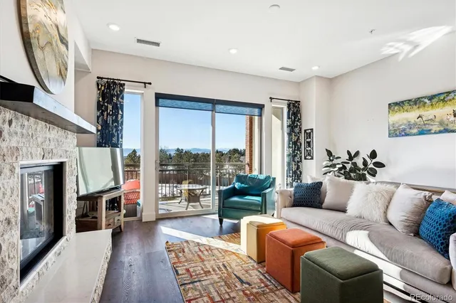 a living room with furniture fireplace and a flat screen tv