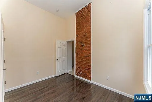 an empty room with wooden floor