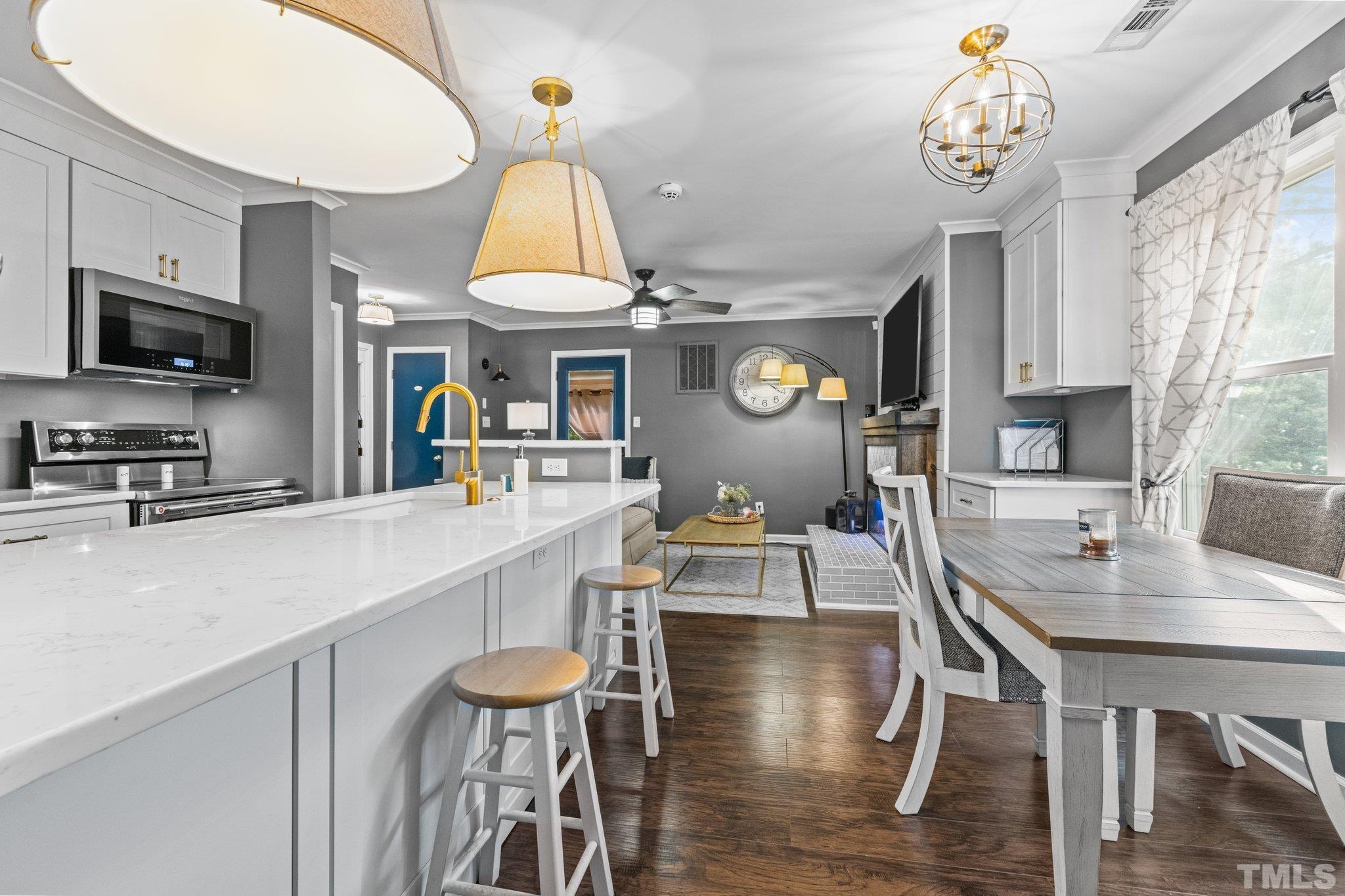 a kitchen with a table chairs and a stove