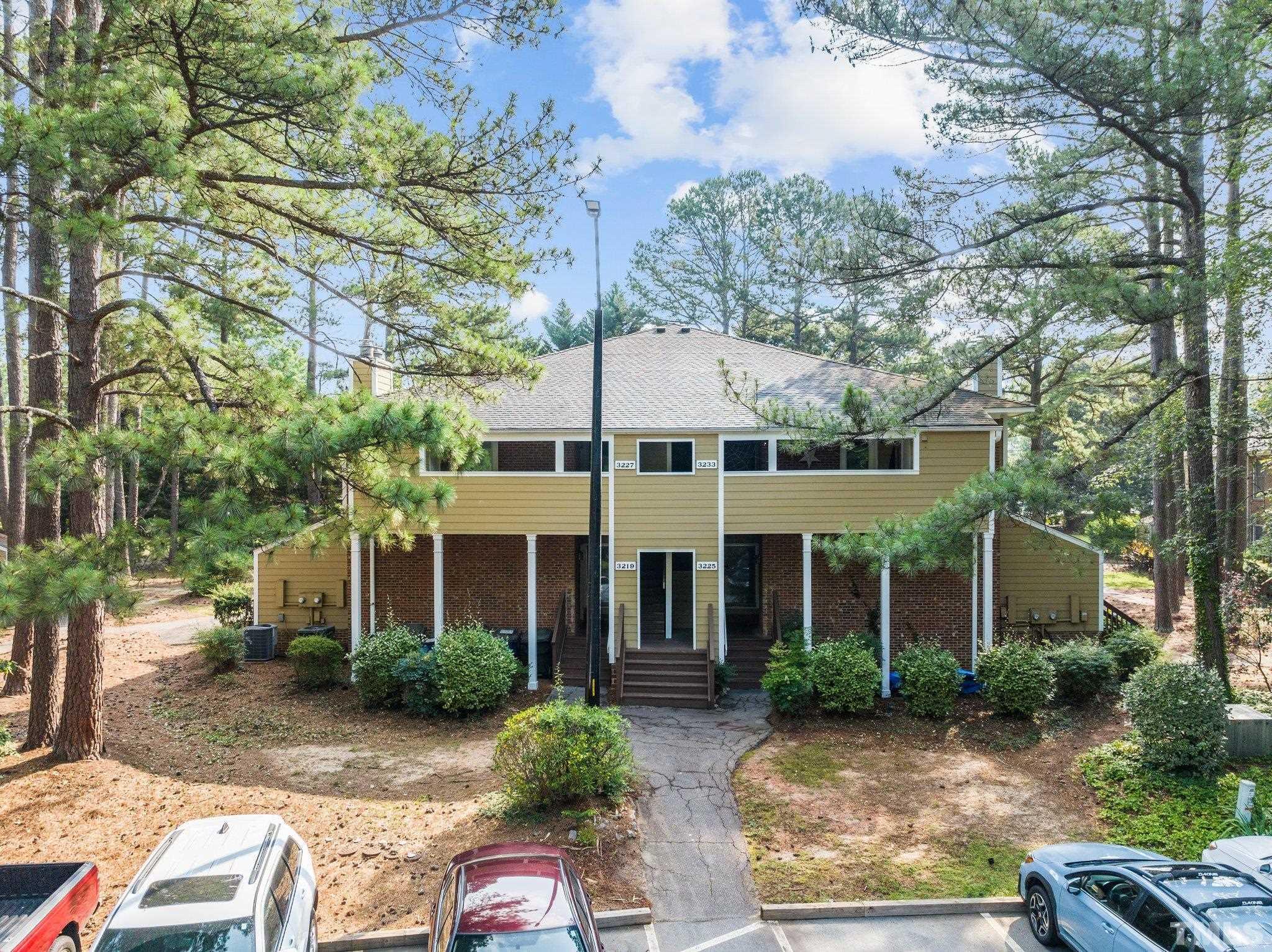 3231 Mill Run, Unit 3231 Raleigh, NC 27612 - Photo 2 of 28 front view of a house with a small yard
