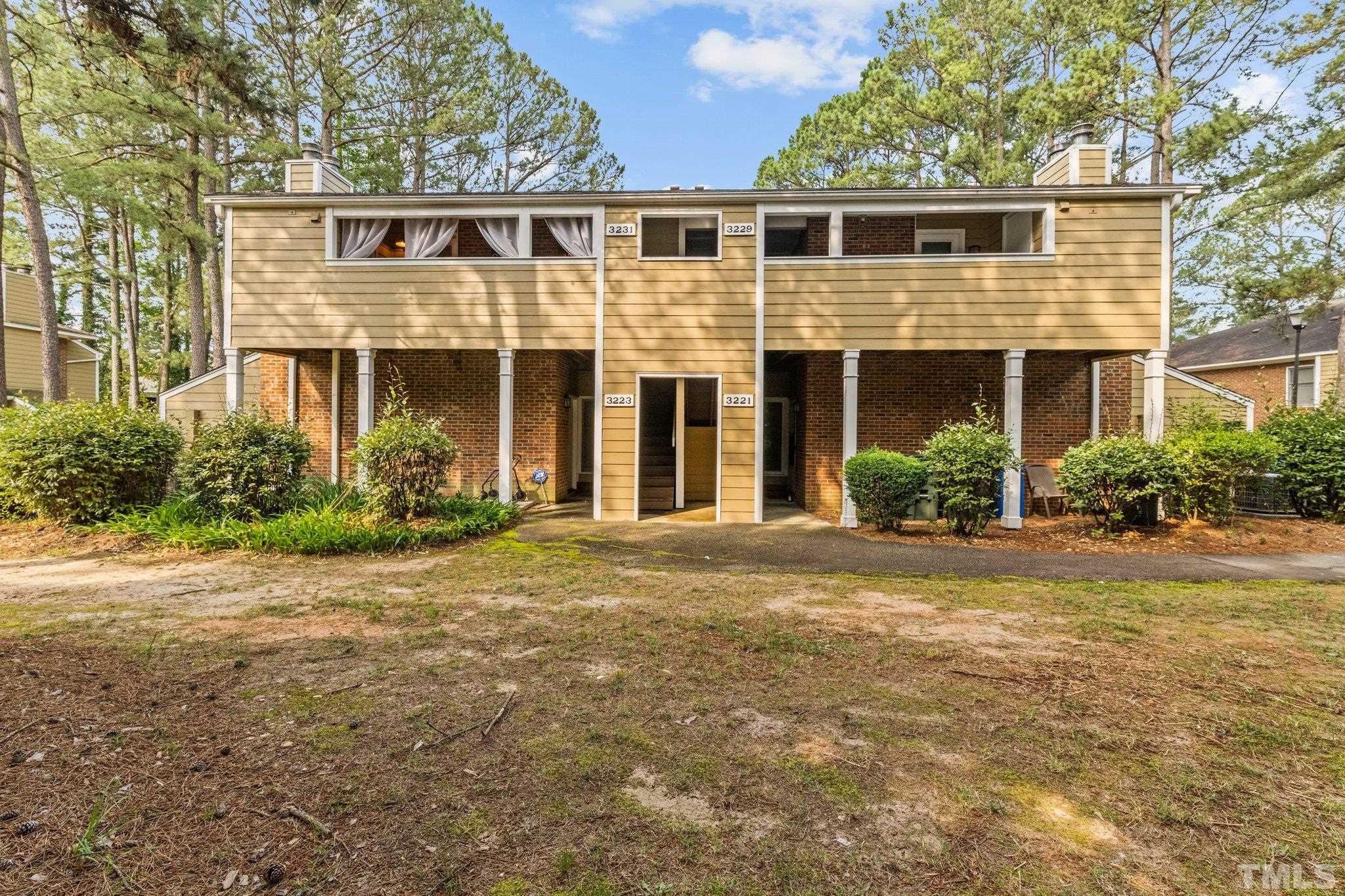 3231 Mill Run, Unit 3231 Raleigh, NC 27612 - Photo 23 of 28 a front view of a house with garden