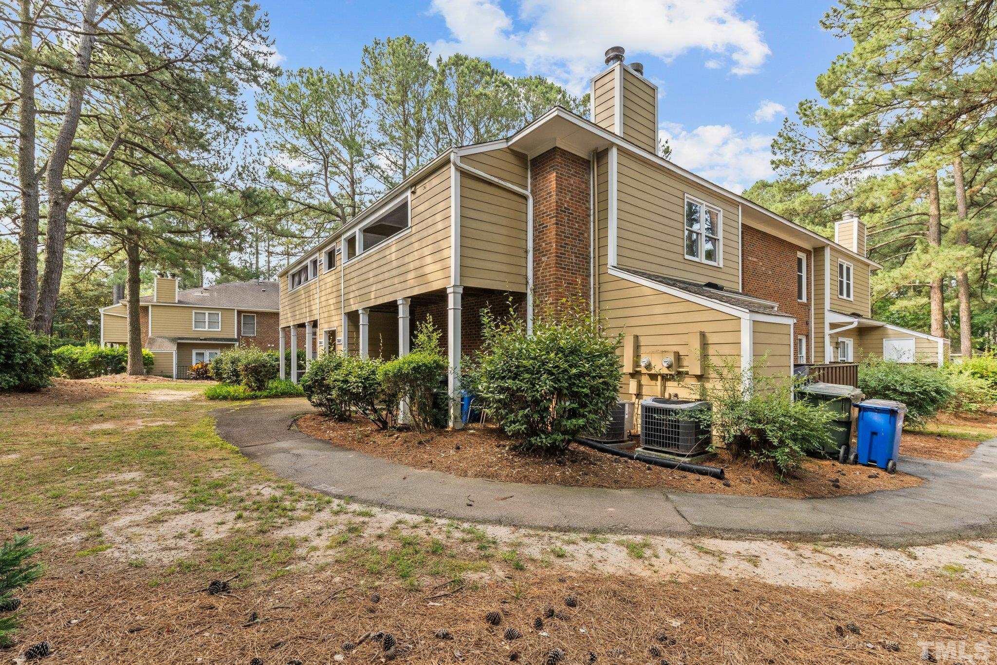 3231 Mill Run, Unit 3231 Raleigh, NC 27612 - Photo 24 of 28 a front view of a house with a yard