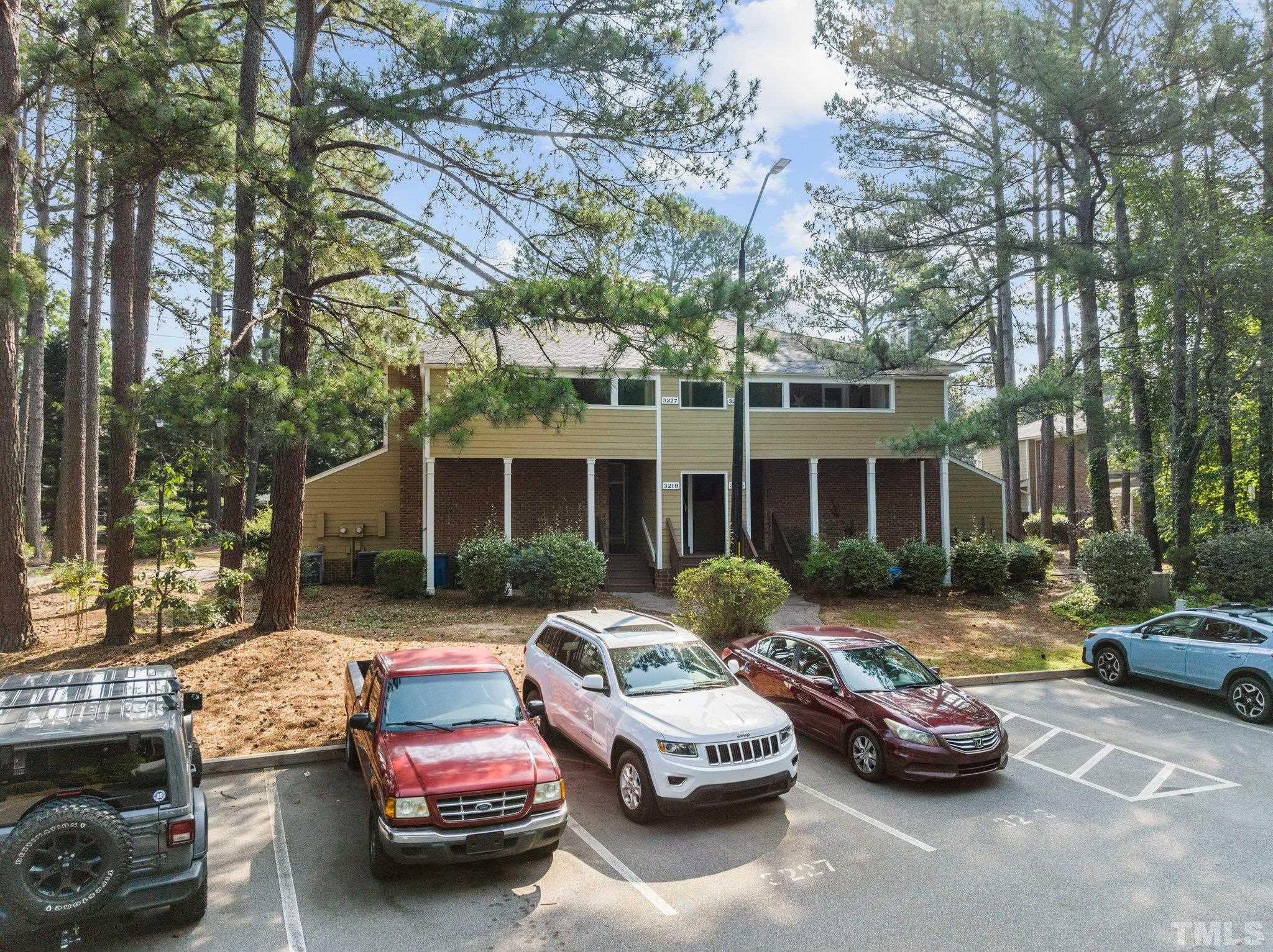 3231 Mill Run, Unit 3231 Raleigh, NC 27612 - Photo 27 of 28 a front view of a house with car parked