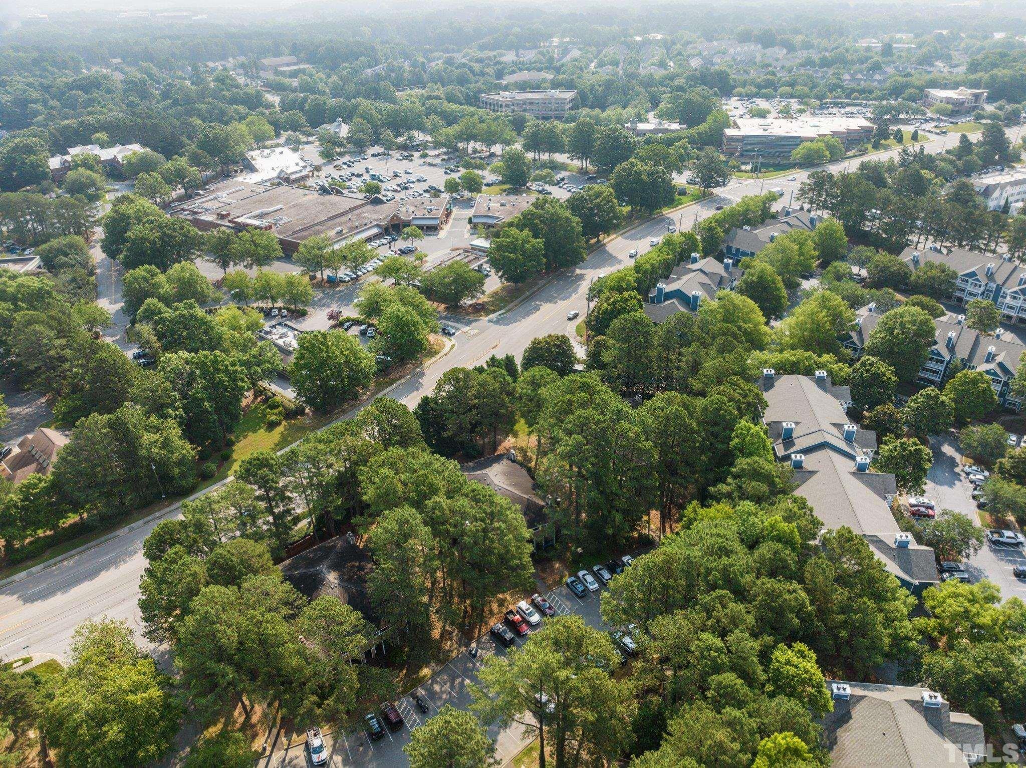 3231 Mill Run, Unit 3231 Raleigh, NC 27612 - Photo 28 of 28 an aerial view of residential houses with city and outdoor space