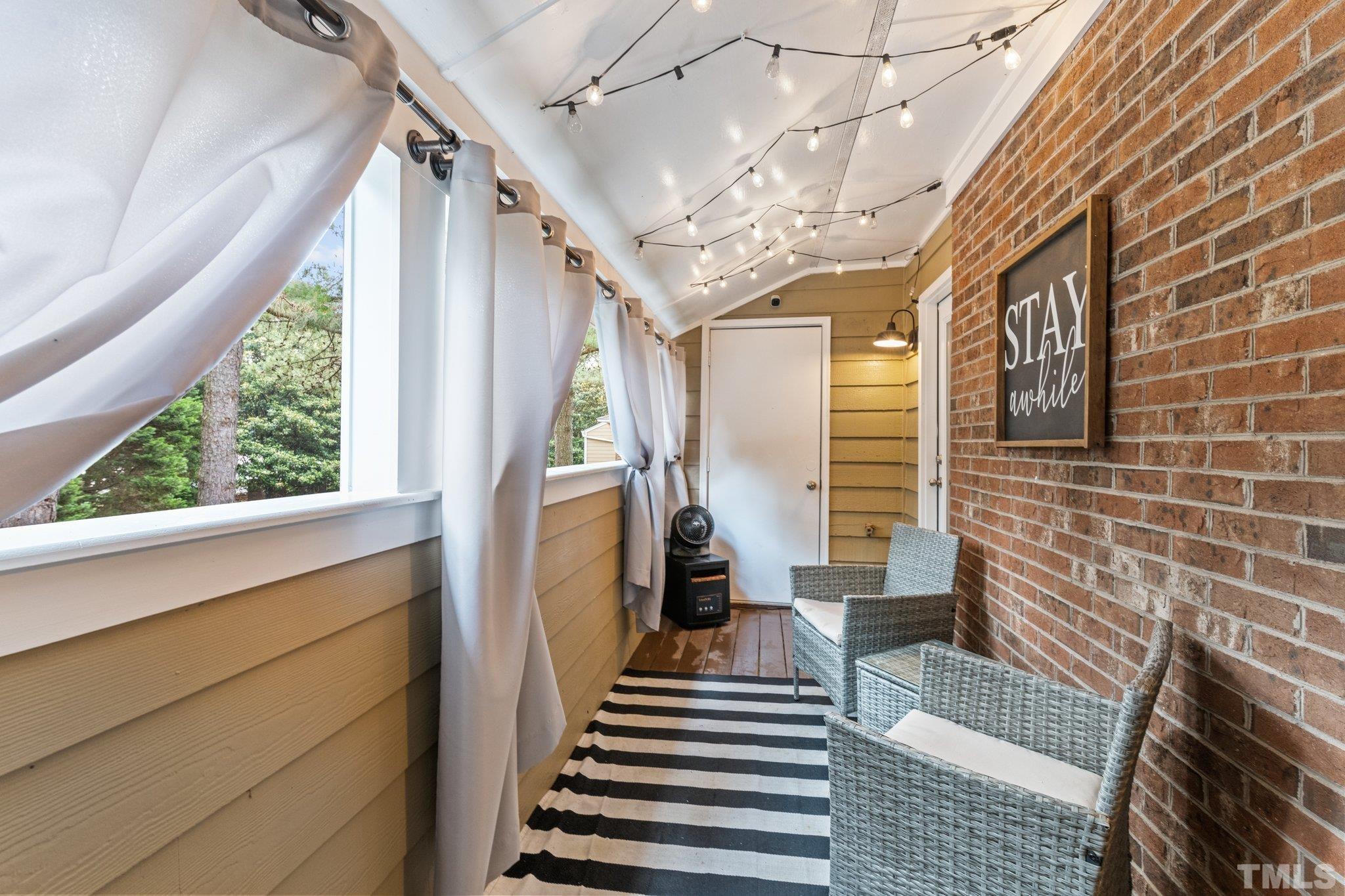 3231 Mill Run, Unit 3231 Raleigh, NC 27612 - Photo 4 of 28 a view of entryway with a front door and wooden floor