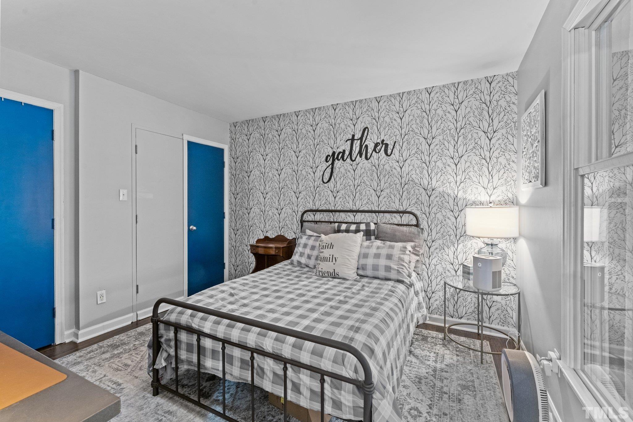 3231 Mill Run, Unit 3231 Raleigh, NC 27612 - Photo 10 of 28 a bedroom with a bed and a painting on the wall