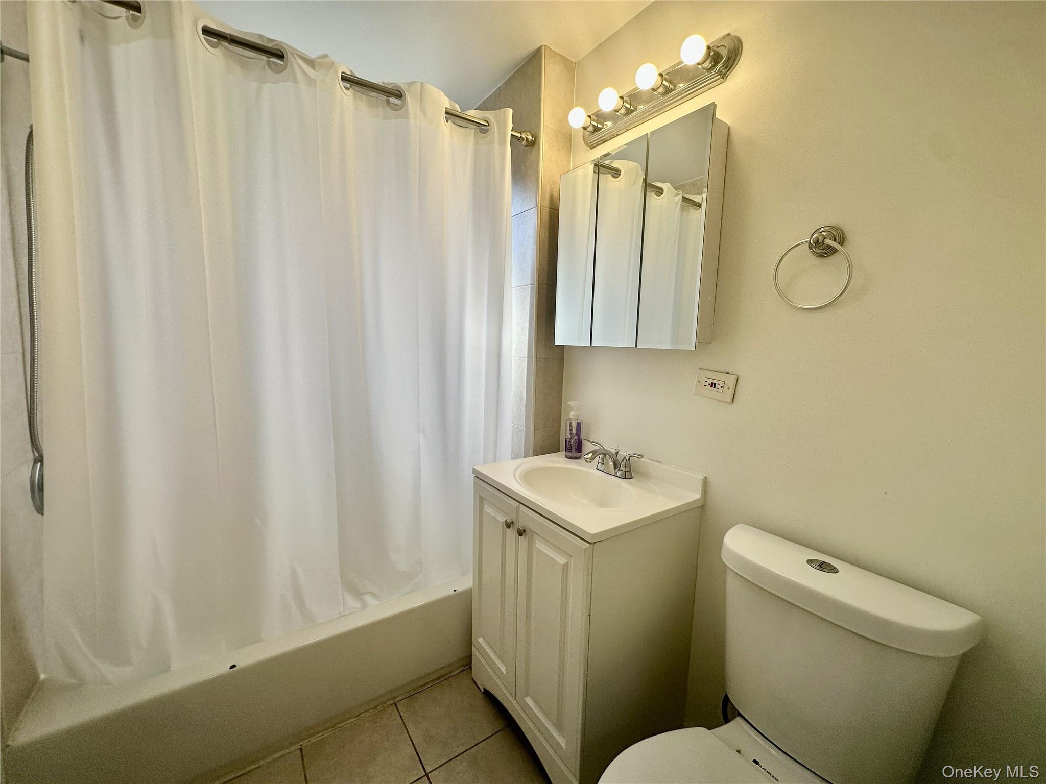 808 Bronx River Road, Unit 4E Bronxville, NY 10708 - Photo 12 of 19 Storage Vanity, tiled Floor. Window in tub