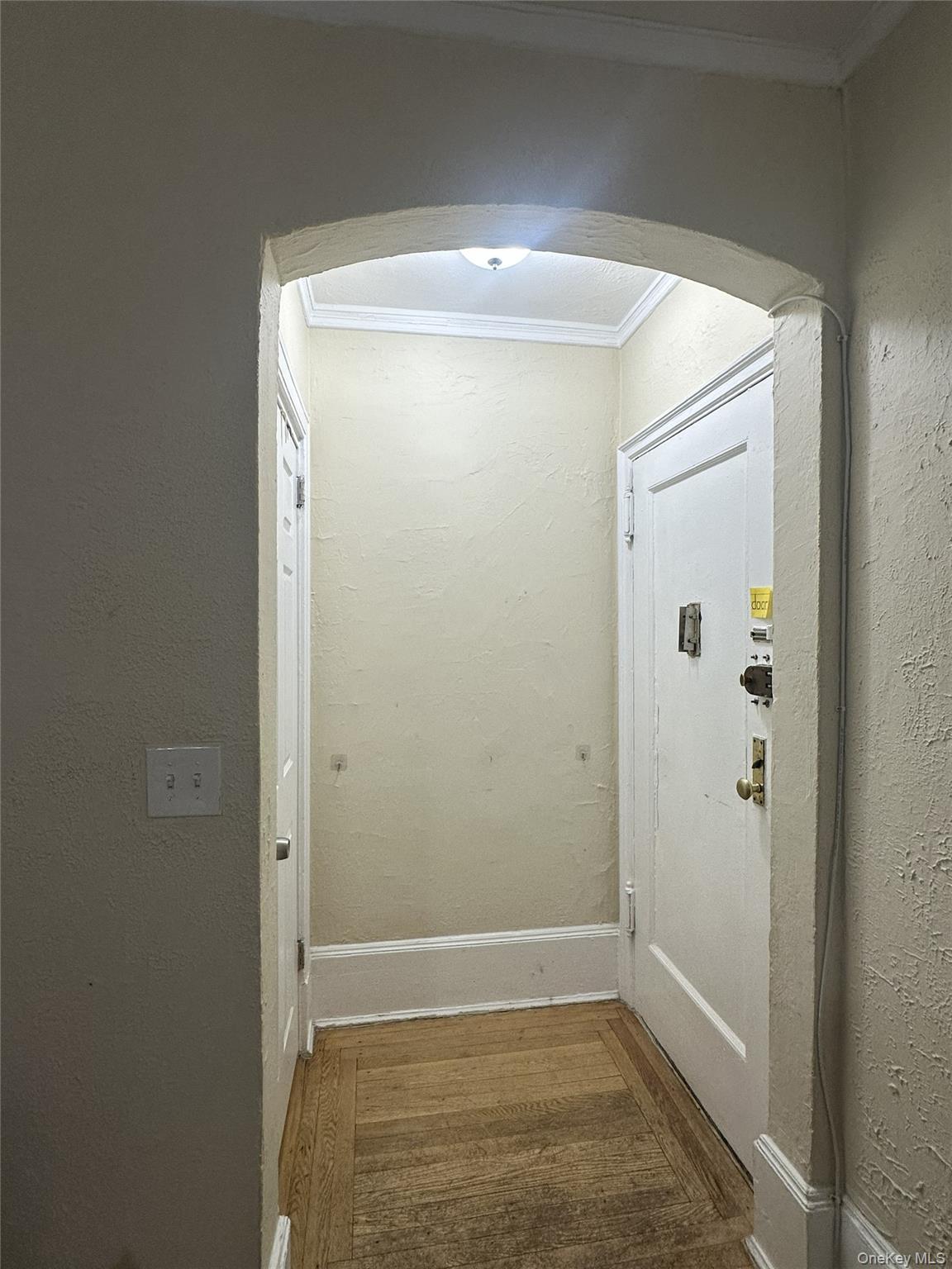 808 Bronx River Road, Unit 4E Bronxville, NY 10708 - Photo 4 of 19 Arched Doorway with Hall Closet to front door.