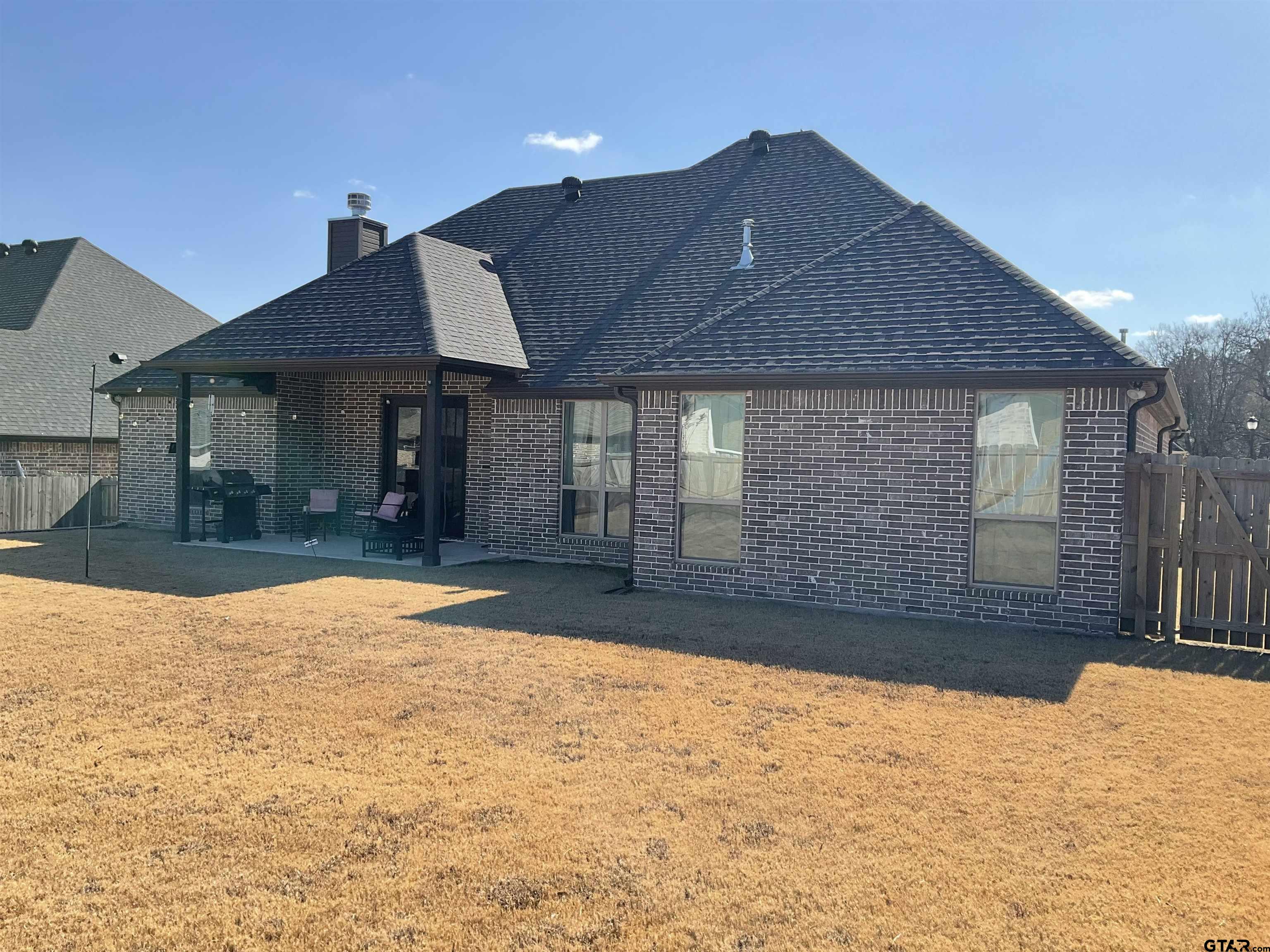11978 Gillian Court Tyler, TX 75703 - Photo 30 of 36 a front view of a house with a yard
