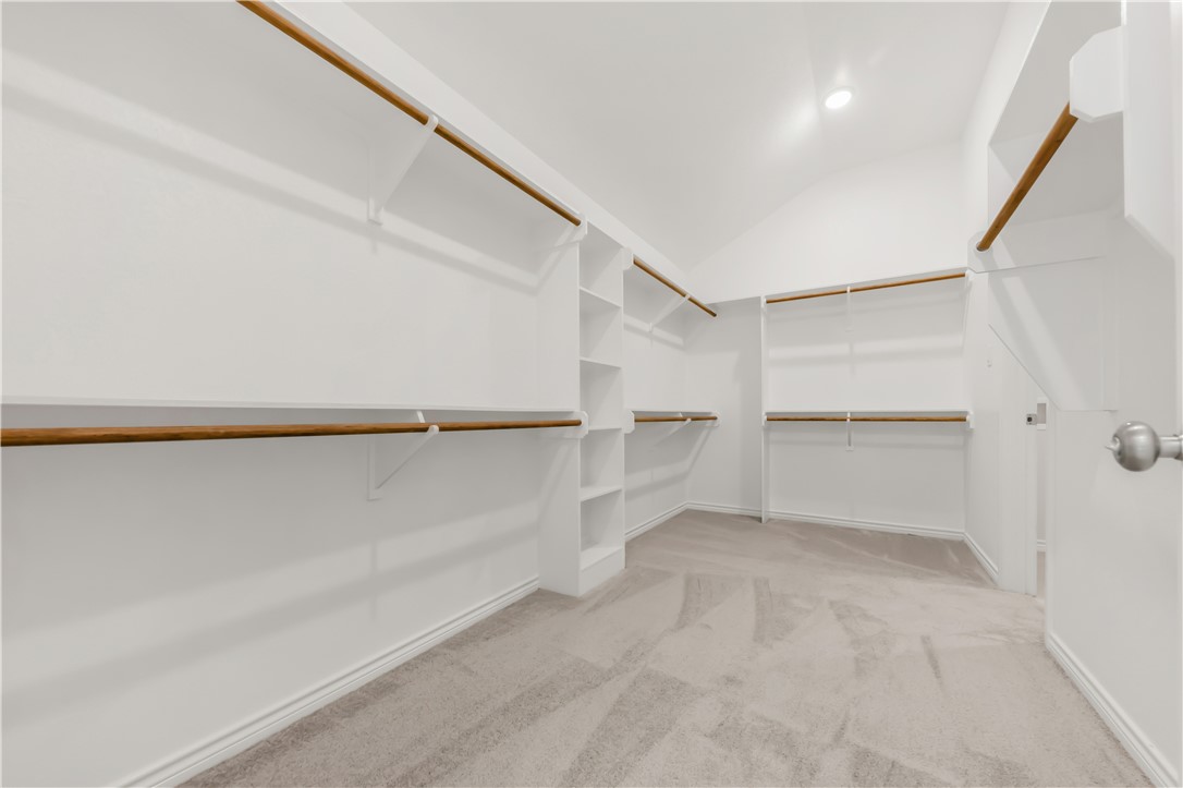 2910 Captain Court Bryan, TX 77808 - Photo 19 of 31 Primary closet connects to the laundry room!