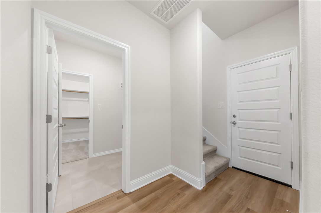 2910 Captain Court Bryan, TX 77808 - Photo 20 of 31 Mud room with garage entry and access to the upstairs bonus room