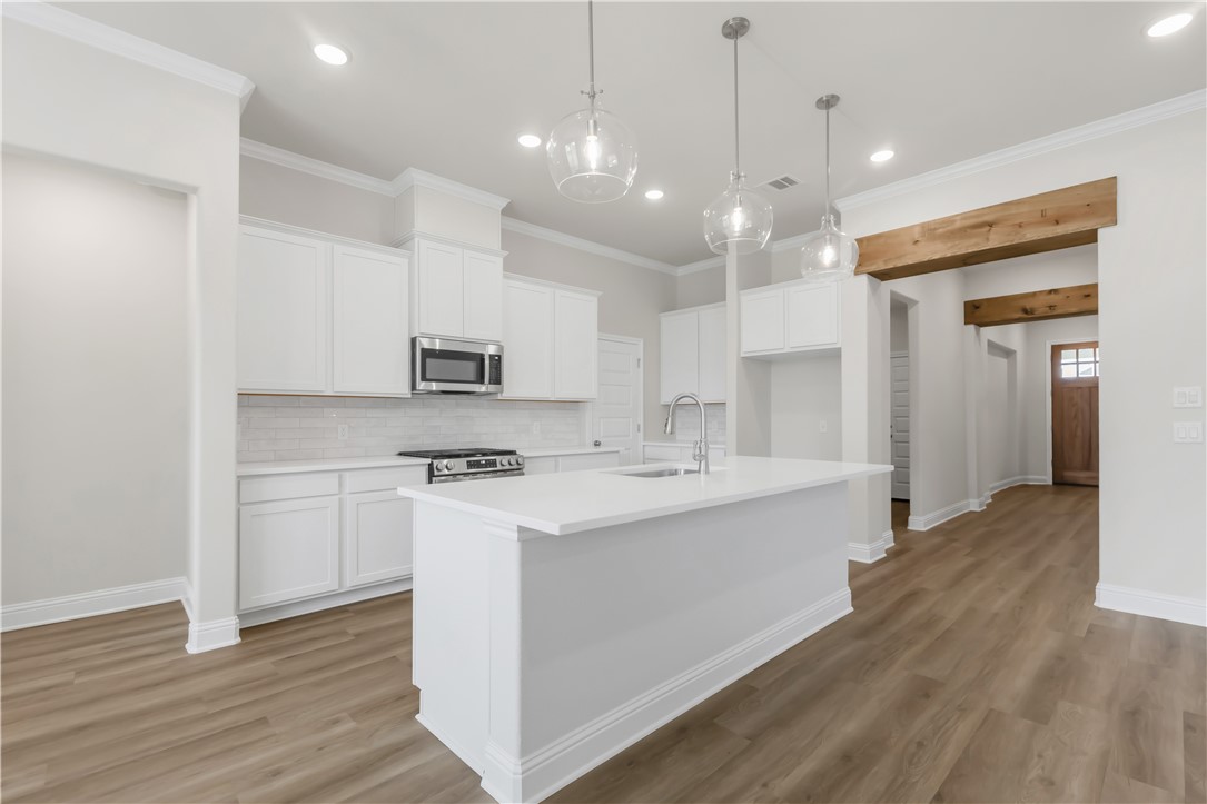 2910 Captain Court Bryan, TX 77808 - Photo 8 of 31 Kitchen looking into the foyer