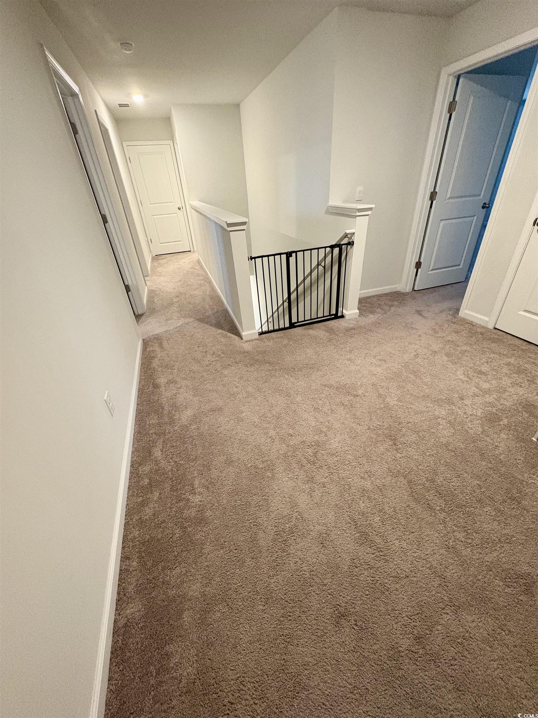 1709 Perthshire Loop Myrtle Beach, SC 29579 - Photo 17 of 38 Corridor with an upstairs landing, carpet floors,