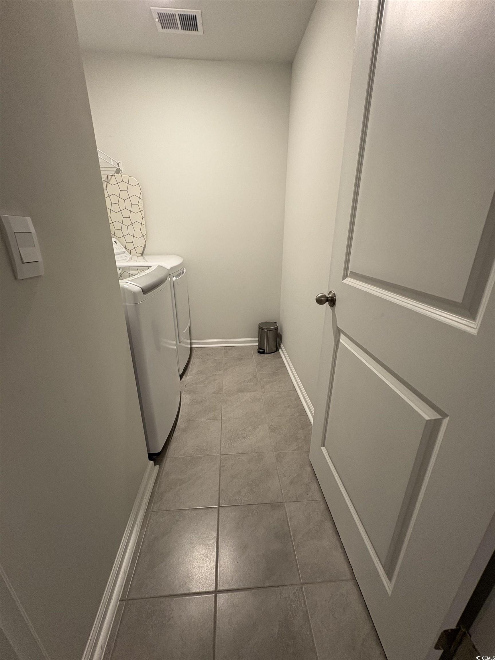 1709 Perthshire Loop Myrtle Beach, SC 29579 - Photo 33 of 38 Washroom with washer and dryer, light tile pattern