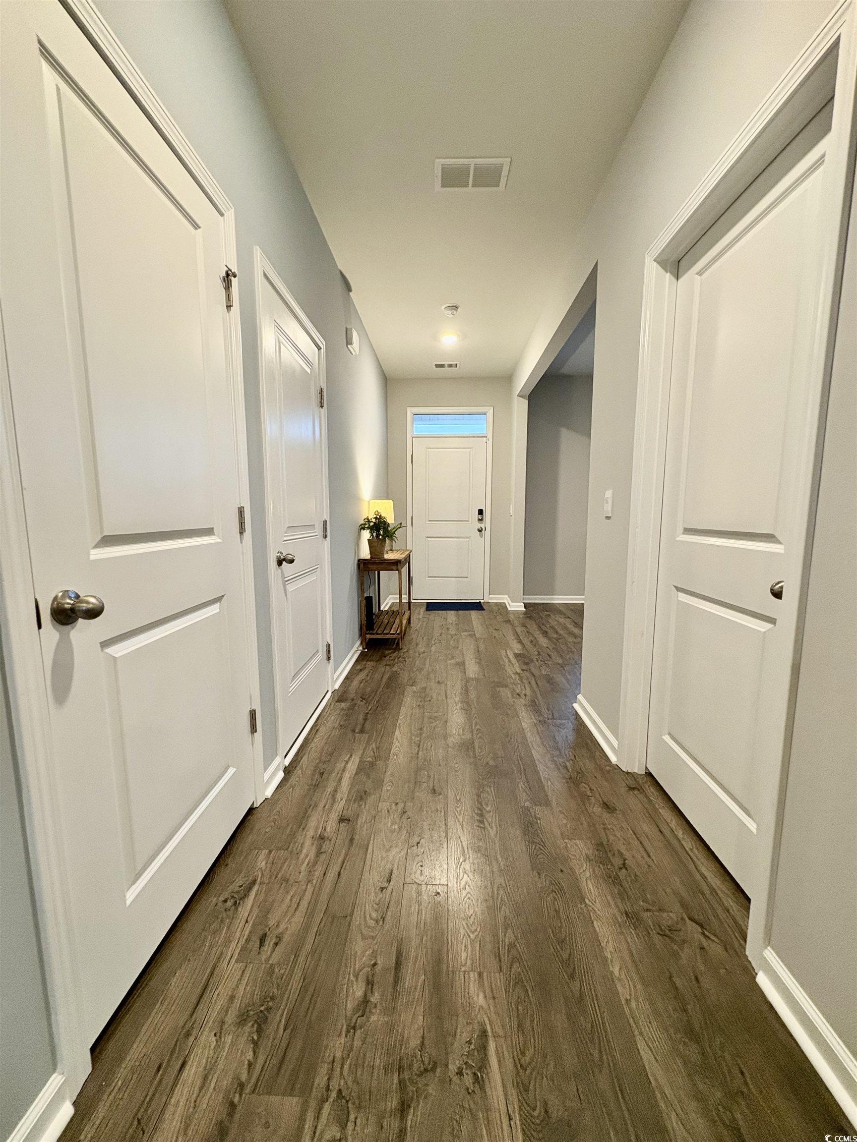 1709 Perthshire Loop Myrtle Beach, SC 29579 - Photo 4 of 38 Corridor featuring dark wood-style floors and base