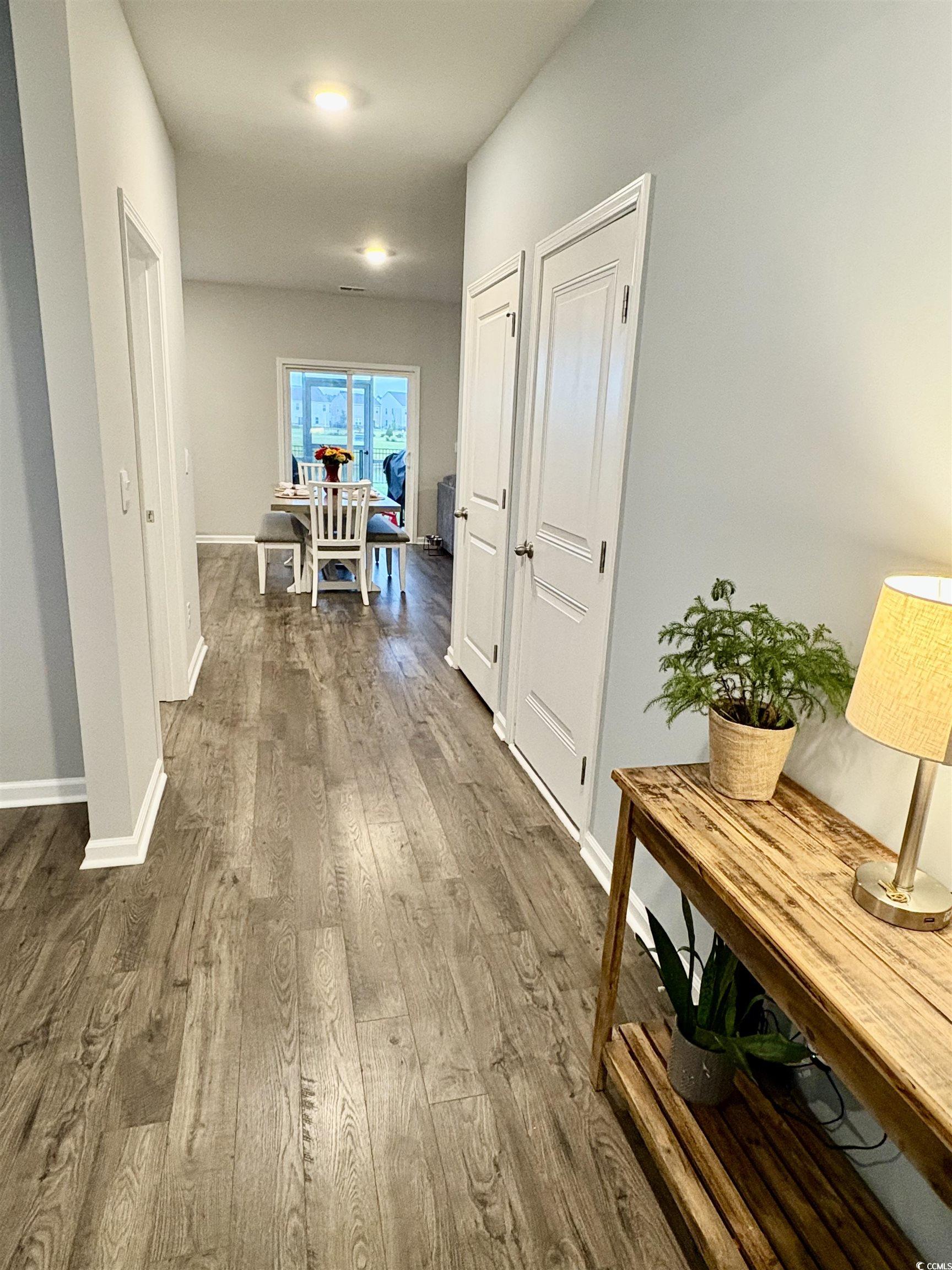 1709 Perthshire Loop Myrtle Beach, SC 29579 - Photo 5 of 38 Corridor with dark wood-type flooring and baseboar