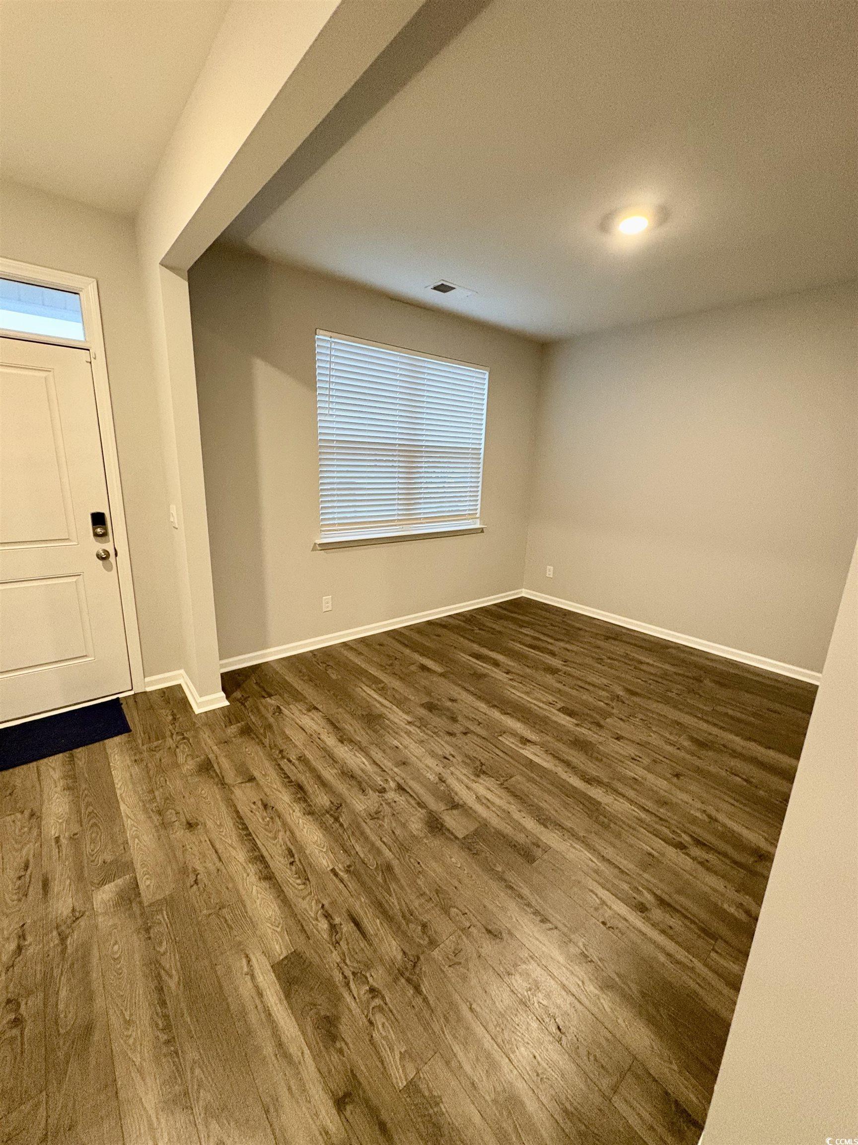 1709 Perthshire Loop Myrtle Beach, SC 29579 - Photo 6 of 38 Foyer with dark wood-style flooring and baseboards