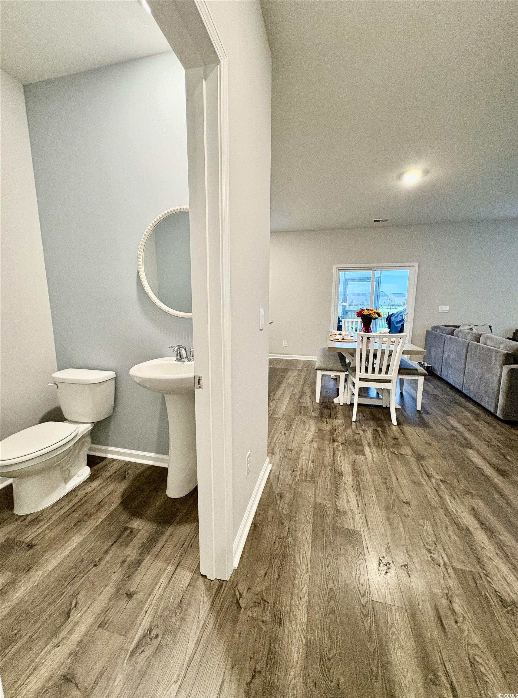 1709 Perthshire Loop Myrtle Beach, SC 29579 - Photo 7 of 38 Half bath with toilet, wood finished floors, and b