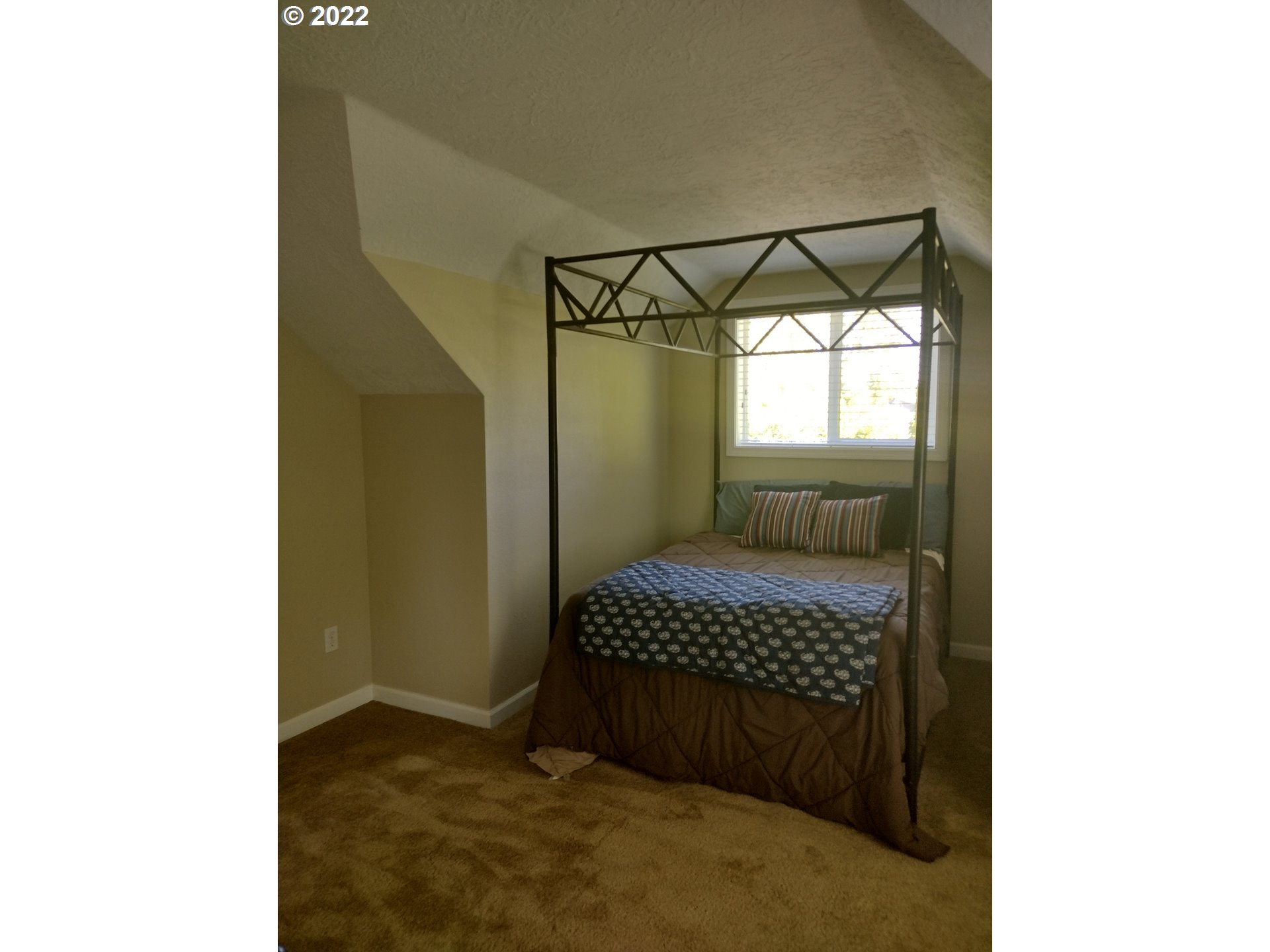 18024 Southeast Marie Street Portland, OR 97236 - Photo 15 of 31 a bedroom with a bed and a window