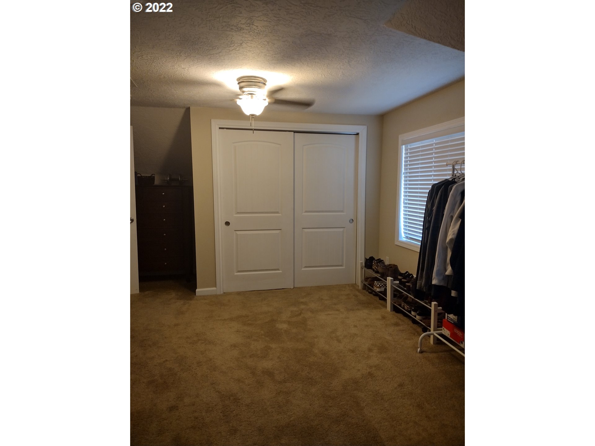 18024 Southeast Marie Street Portland, OR 97236 - Photo 17 of 31 a view of a room with a ceiling fan