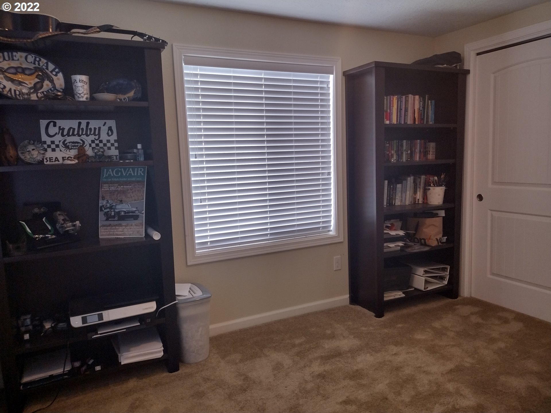 18024 Southeast Marie Street Portland, OR 97236 - Photo 19 of 31 a room with bookshelf and a window