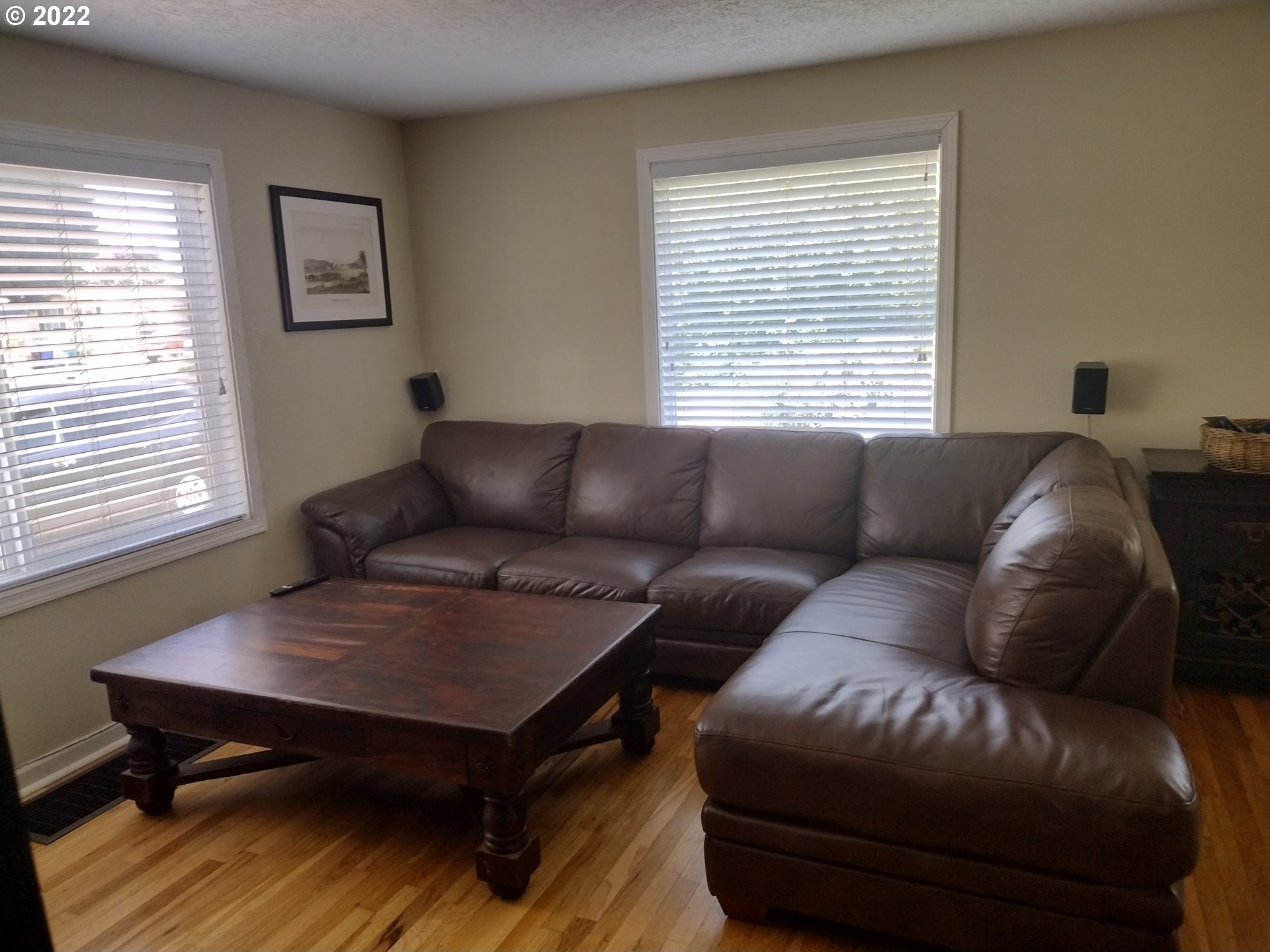 18024 Southeast Marie Street Portland, OR 97236 - Photo 2 of 31 a living room with a couch and a window