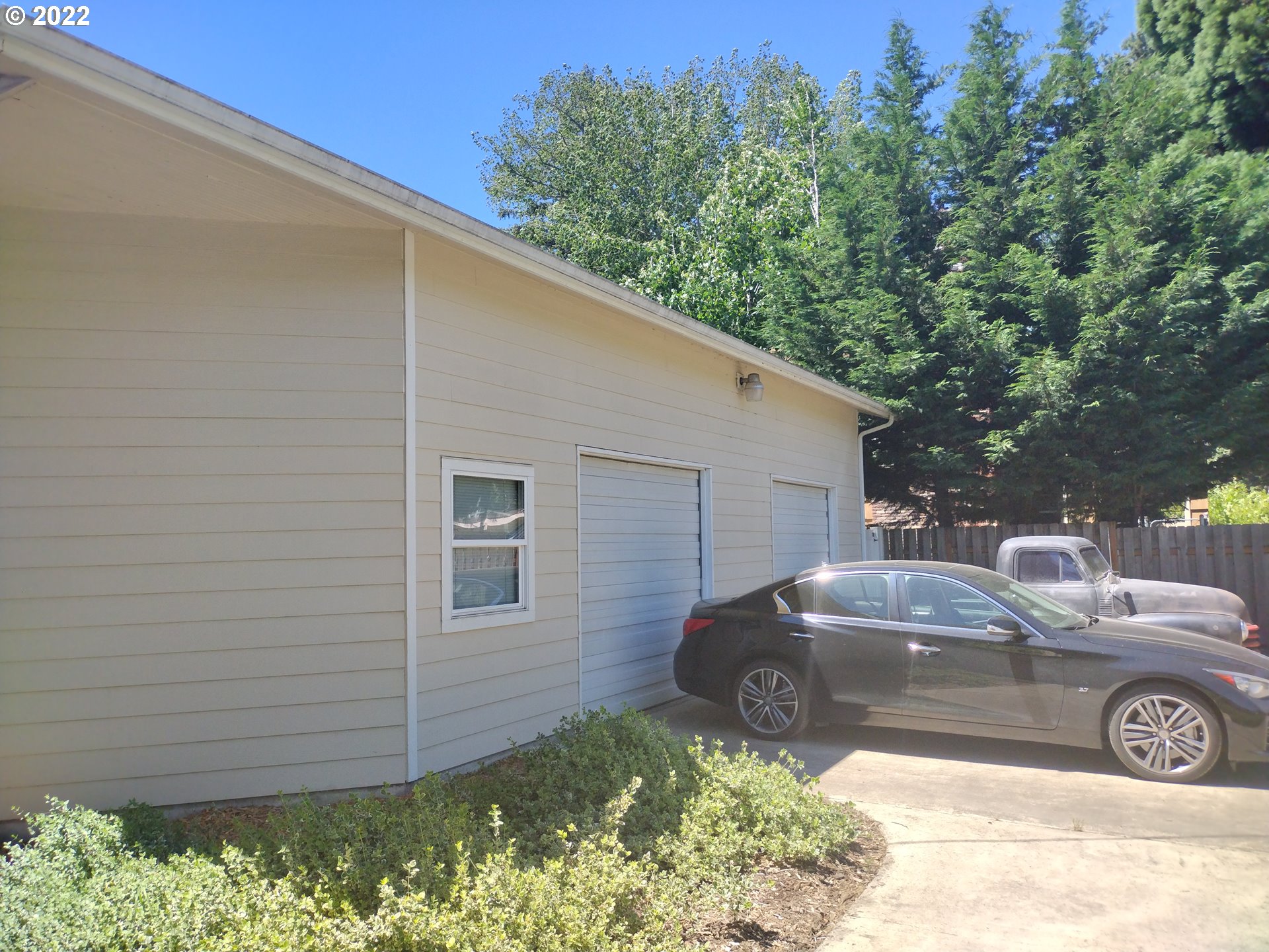 18024 Southeast Marie Street Portland, OR 97236 - Photo 28 of 31 a couple of cars parked in front of a house