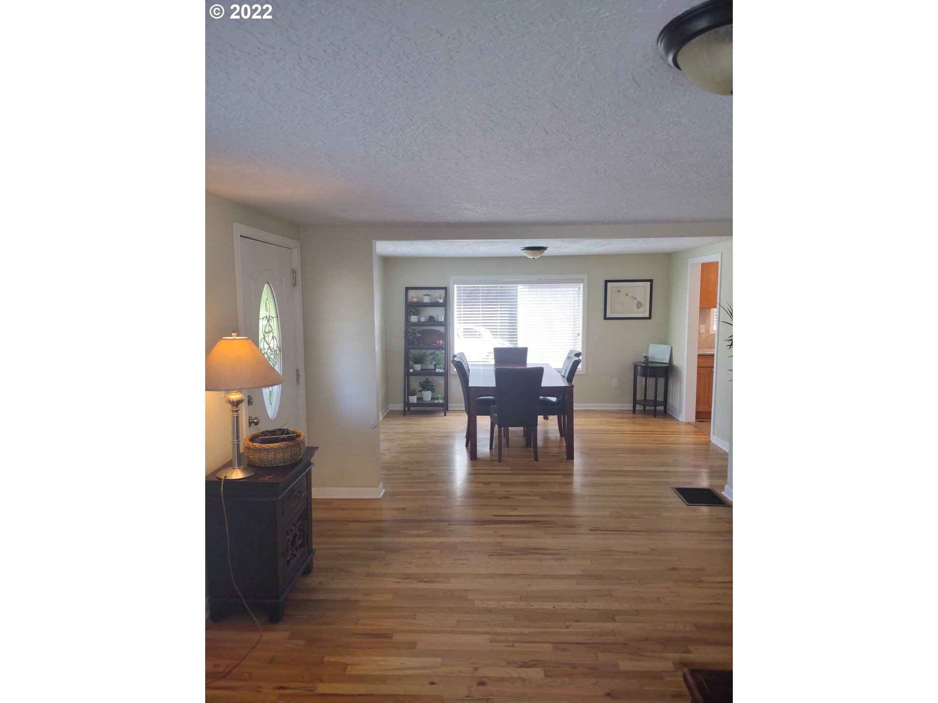 18024 Southeast Marie Street Portland, OR 97236 - Photo 4 of 31 a living room with furniture and dining table