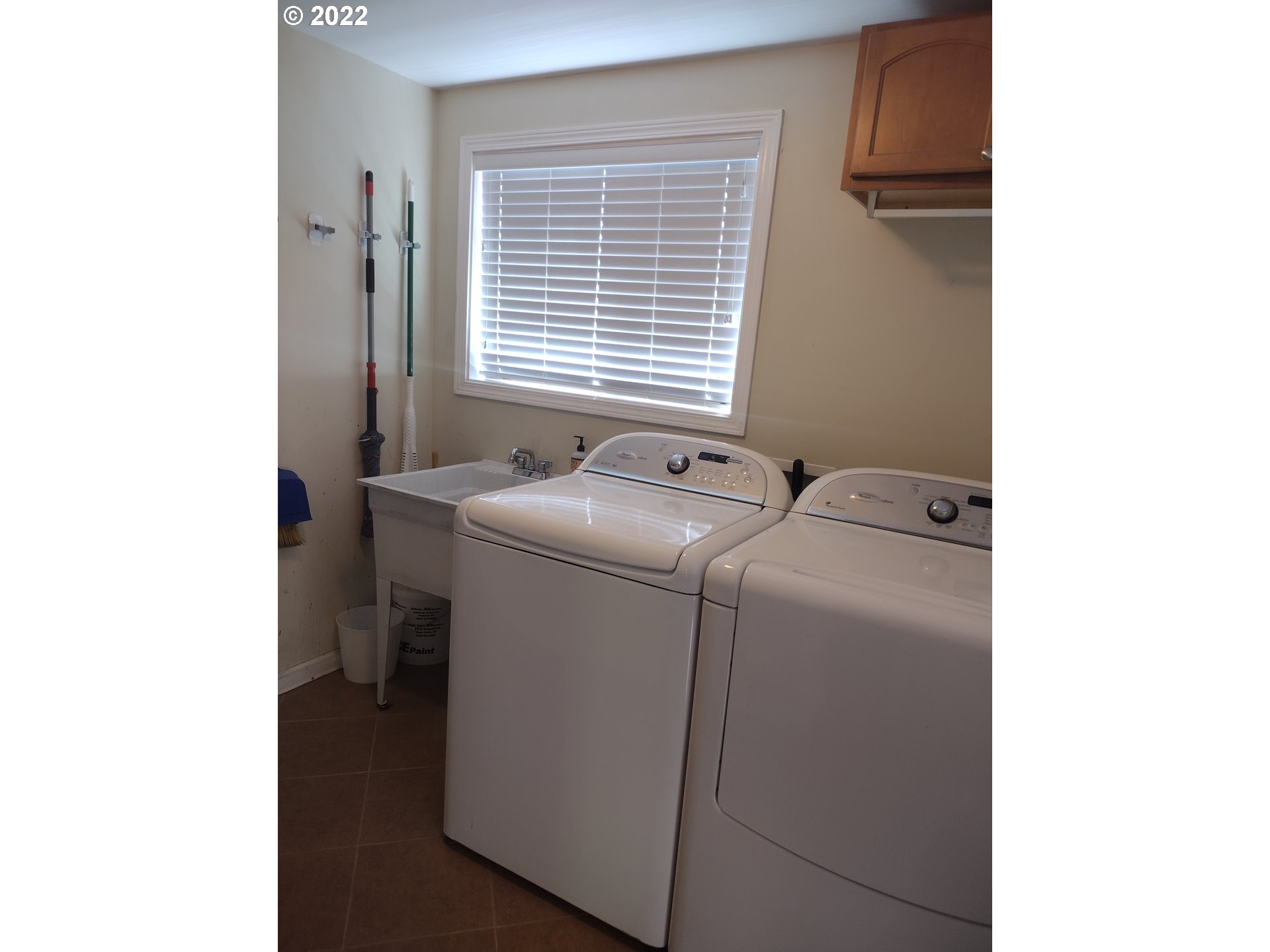 18024 Southeast Marie Street Portland, OR 97236 - Photo 9 of 31 a utility room with dryer and washer
