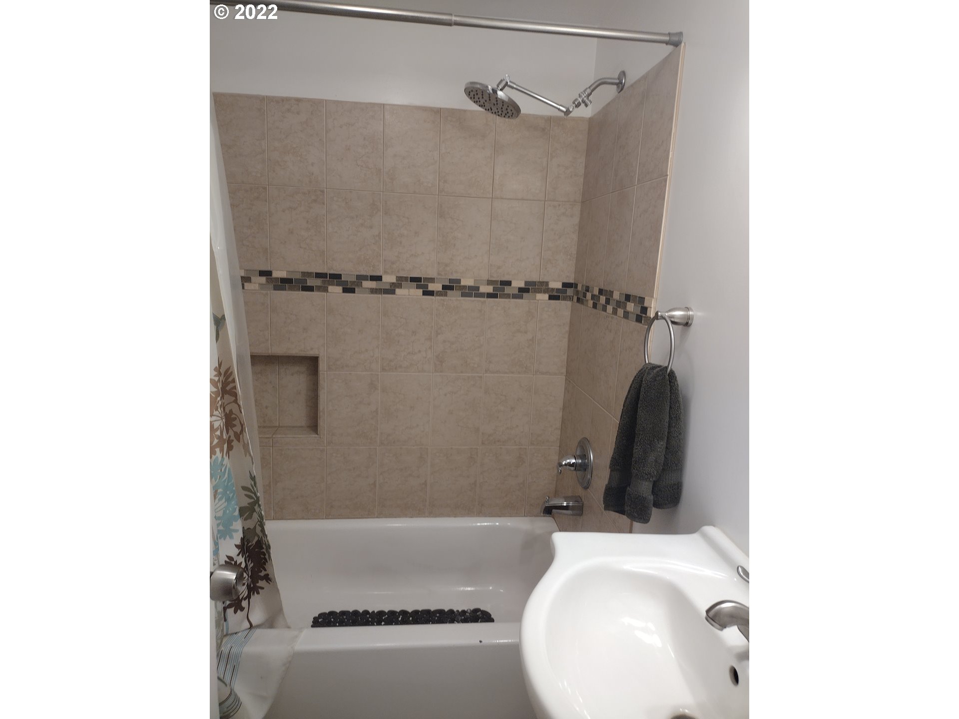 18024 Southeast Marie Street Portland, OR 97236 - Photo 10 of 31 a bathroom with a toilet and a bathtub
