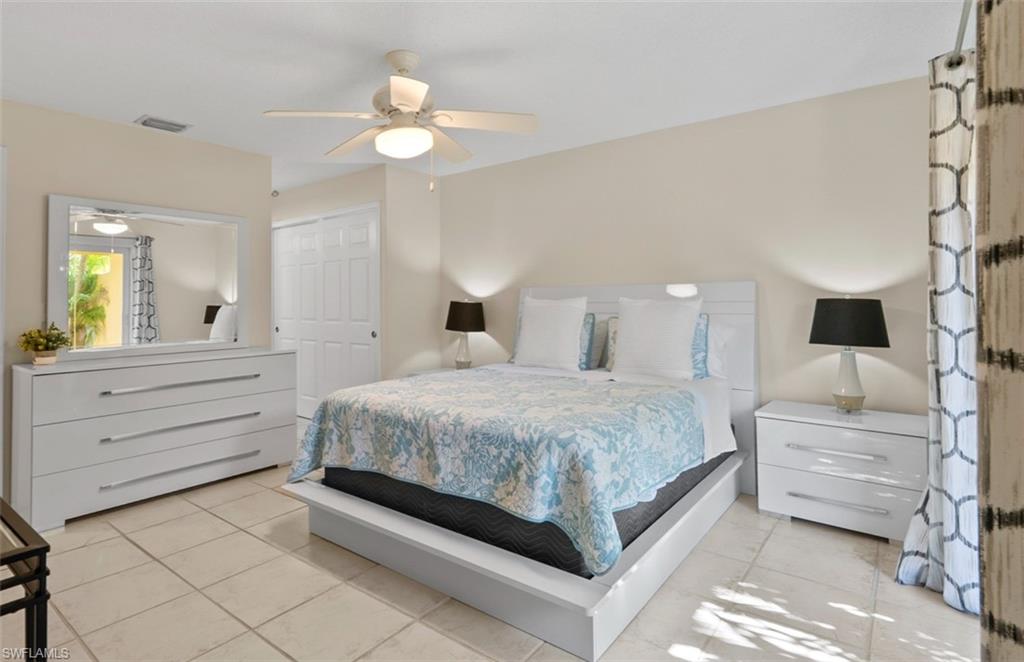 136 Harrison Road, Unit 1 Naples, FL 34112 - Photo 11 of 29 Light-toned tile flooring extends throughout this interior space