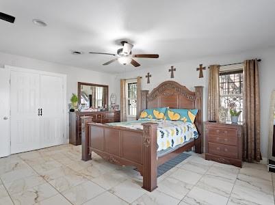 2133 Pleasant Drive Dallas, TX 75227 - Photo 14 of 40 Bedroom with ceiling fan and light marble finish floors