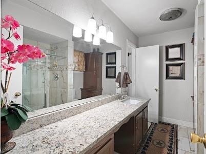 2133 Pleasant Drive Dallas, TX 75227 - Photo 15 of 40 Bathroom with a shower stall and vanity