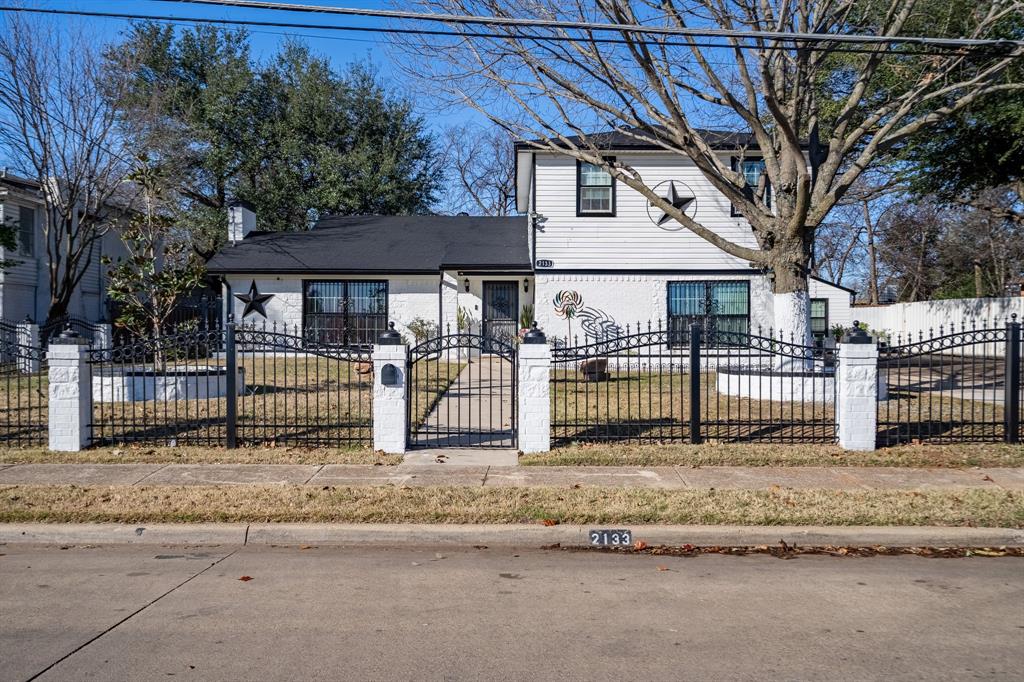 2133 Pleasant Drive Dallas, TX 75227 - Photo 39 of 40 View of front of home featuring a fenced front yard and a gate