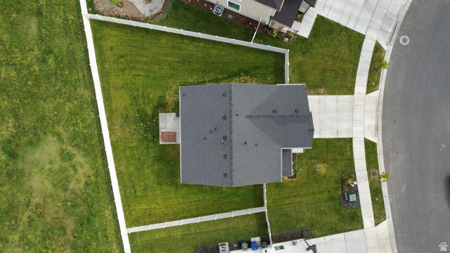 1566 Silver Canoe Loop Logan, UT 84321 - Photo 41 of 44 Expansive lot featuring a dark gray shingle roof, concrete driveway, and a concrete patio