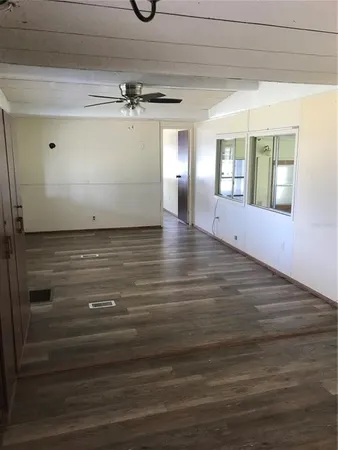 a view of a livingroom with wooden floor