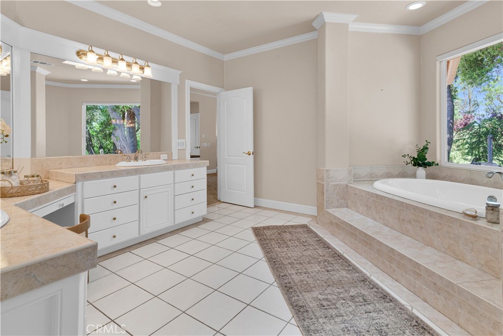 117 Frontier Way Templeton, CA 93465 - Photo 30 of 57 a spacious bathroom with a granite countertop sink and a bathtub