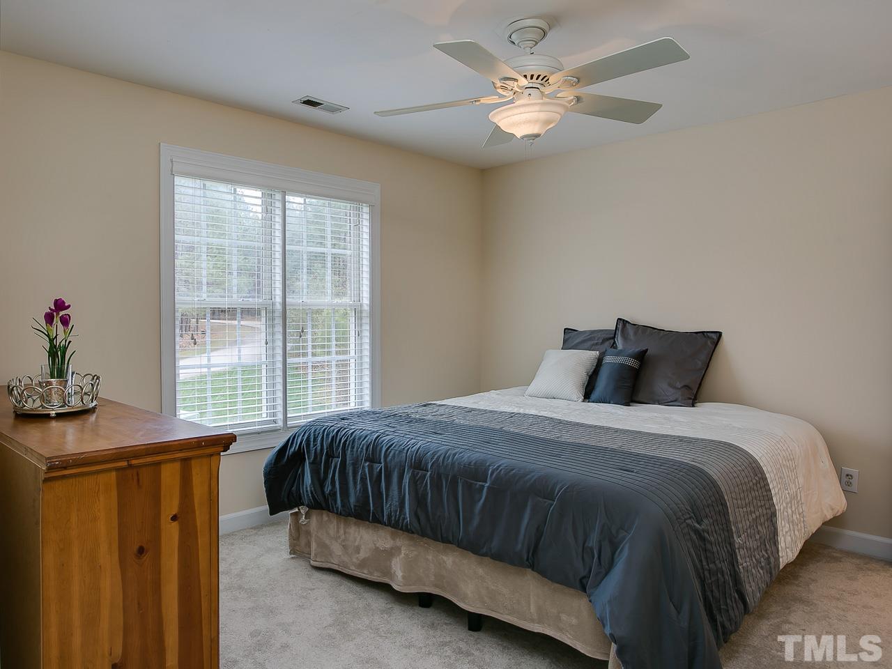 832 Kings Cross Way Raleigh, NC 27615 - Photo 13 of 25 a bedroom with a bed and a window