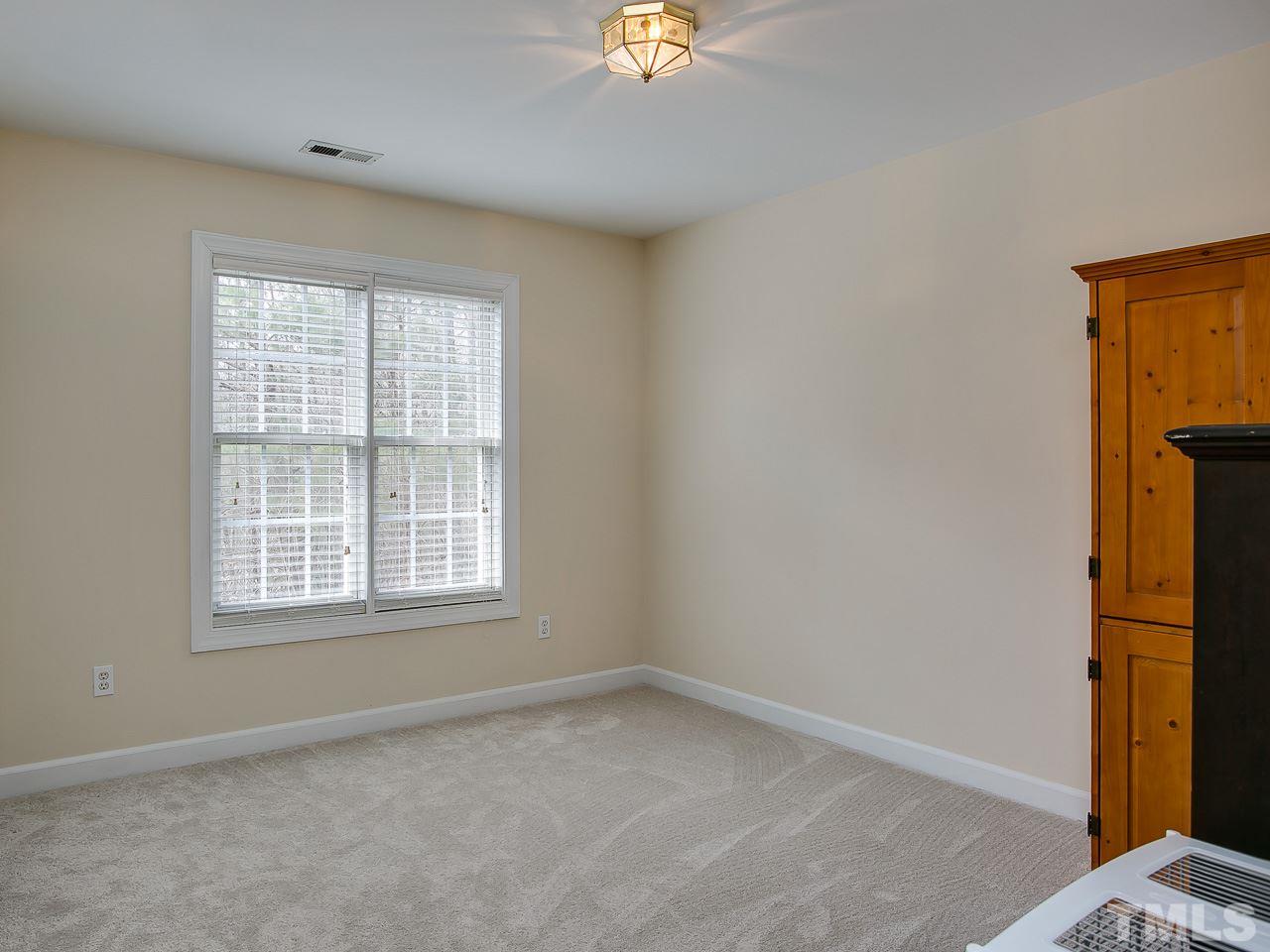 832 Kings Cross Way Raleigh, NC 27615 - Photo 17 of 25 an empty room with a window