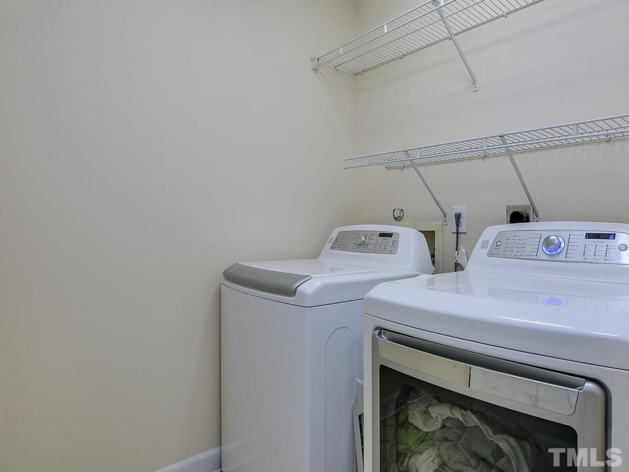 832 Kings Cross Way Raleigh, NC 27615 - Photo 21 of 25 a utility room with dryer and washer