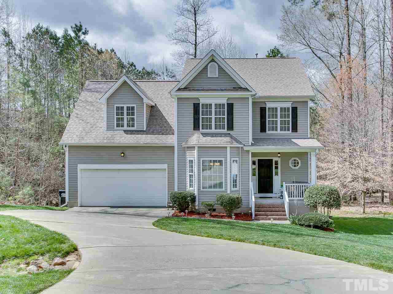 832 Kings Cross Way Raleigh, NC 27615 - Photo 24 of 25 a front view of a house with a yard and garage