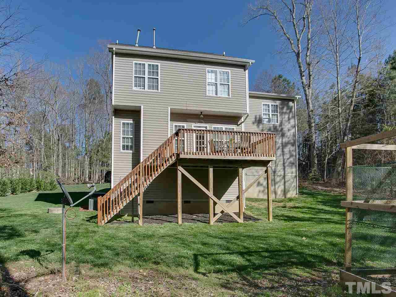 832 Kings Cross Way Raleigh, NC 27615 - Photo 25 of 25 a view of a house with a yard