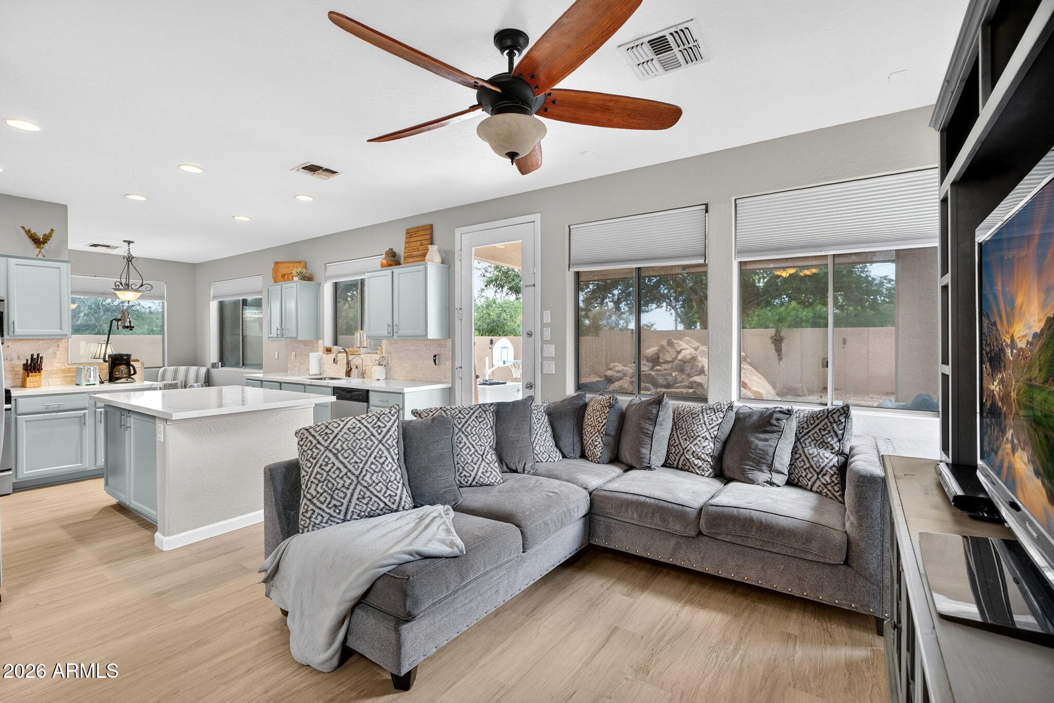 6280 South Sinova Court Gilbert, AZ 85298 - Photo 14 of 64 a living room with furniture and a flat screen tv