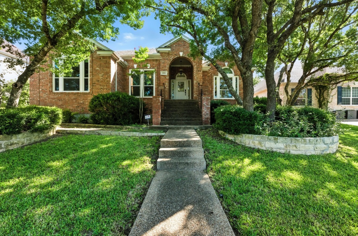 a front view of a house with garden