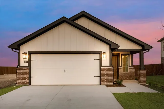 a front view of a house with garage