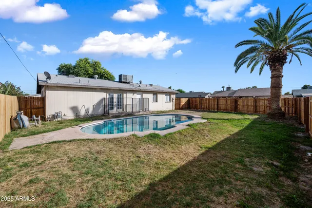 a view of a swimming pool with a garden